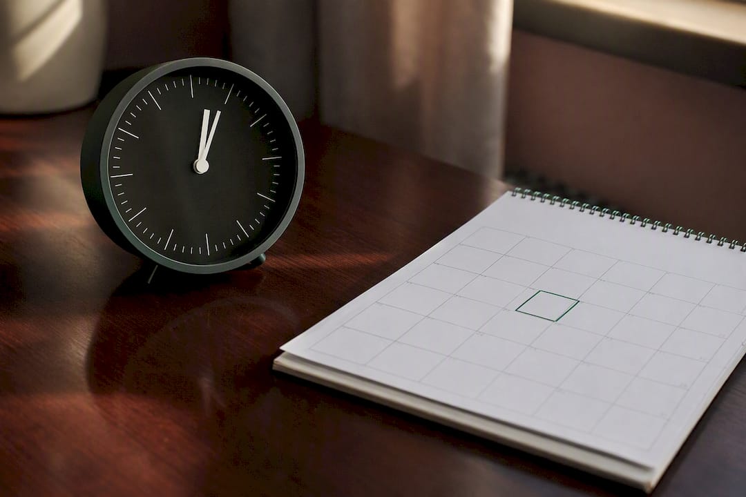 Clock and calendar on wooden desk