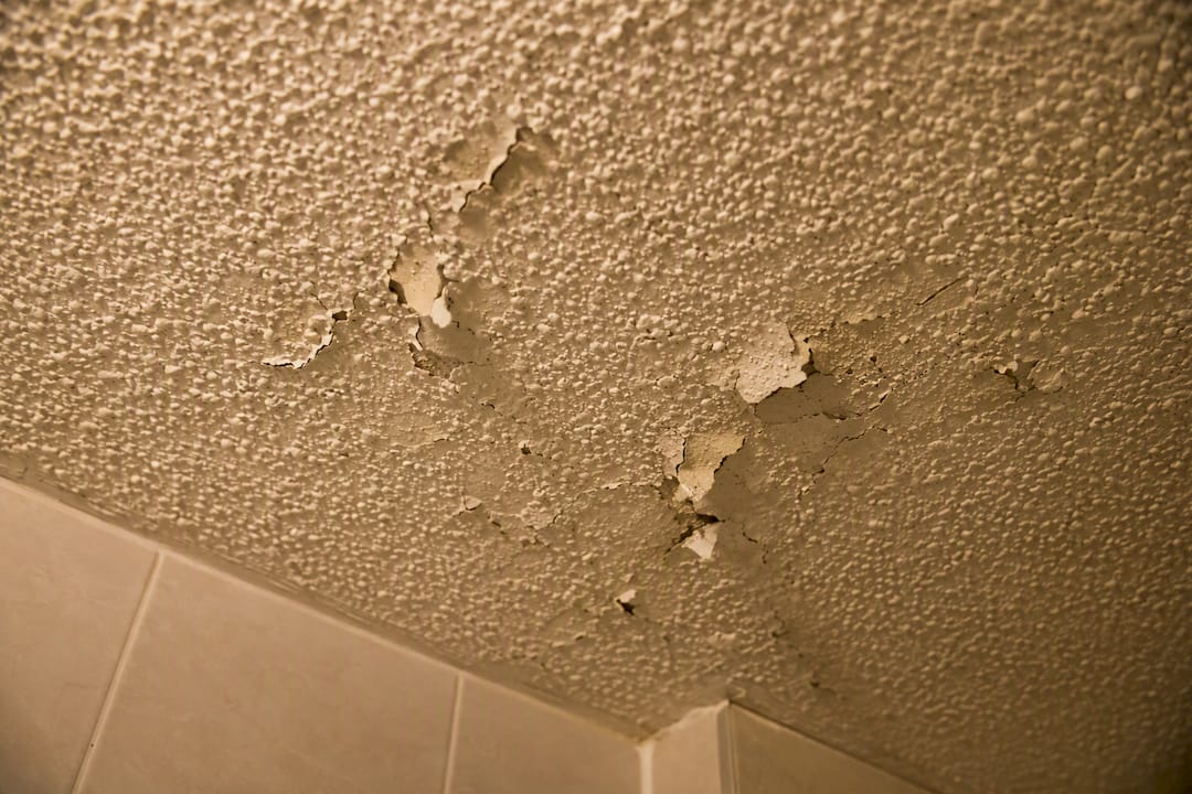 Close-up of damaged popcorn ceiling texture