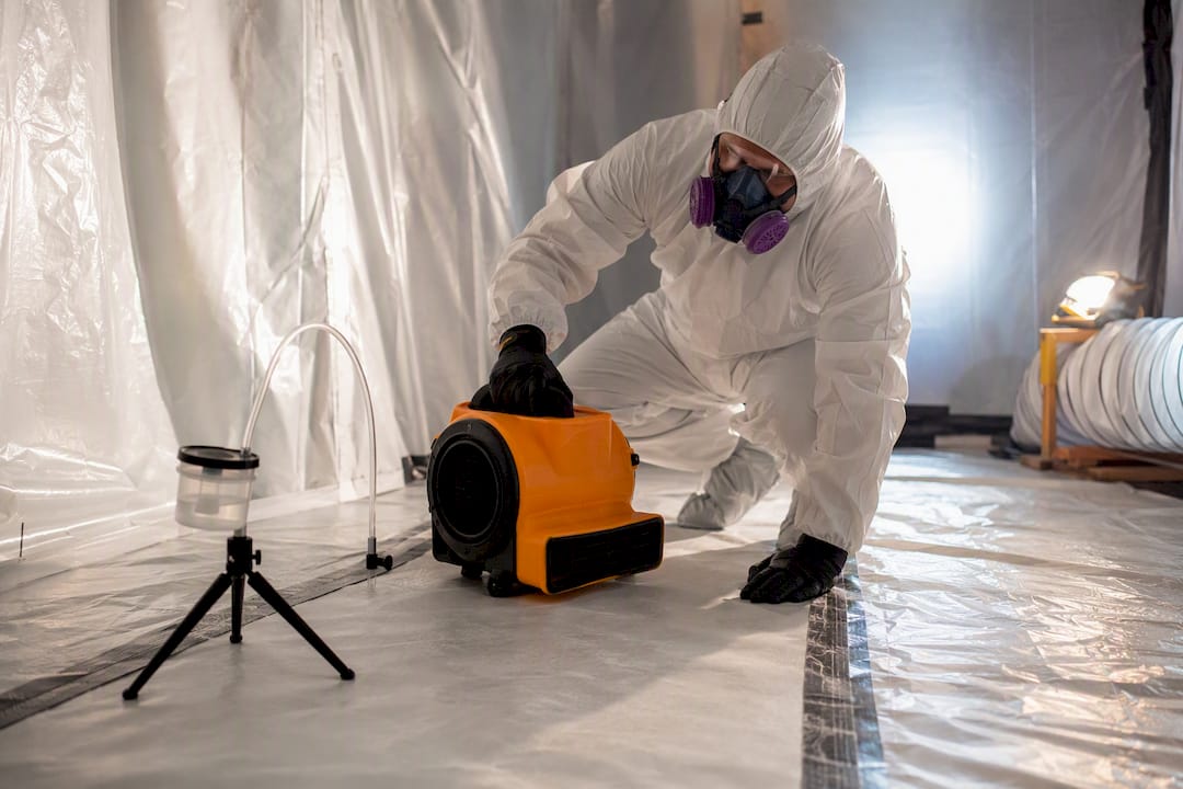 Technician performing aggressive clearance sampling