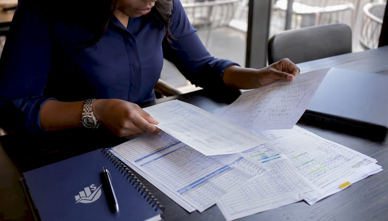 Payroll specialist reconciling payroll records