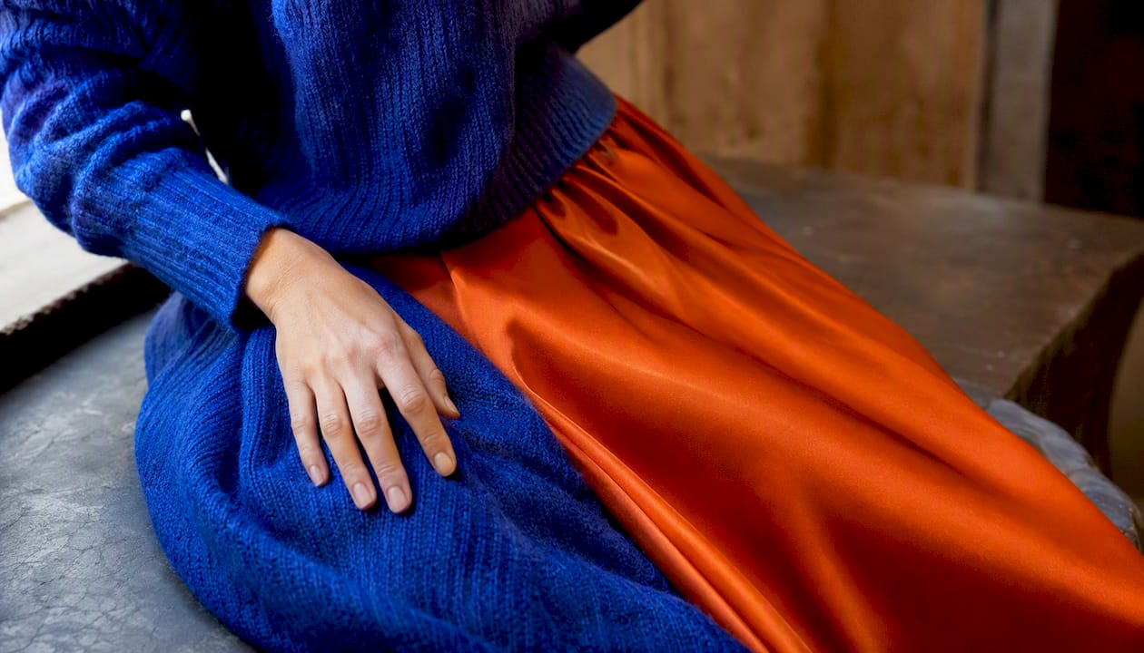 Close-up of blue wool and orange silk fabrics