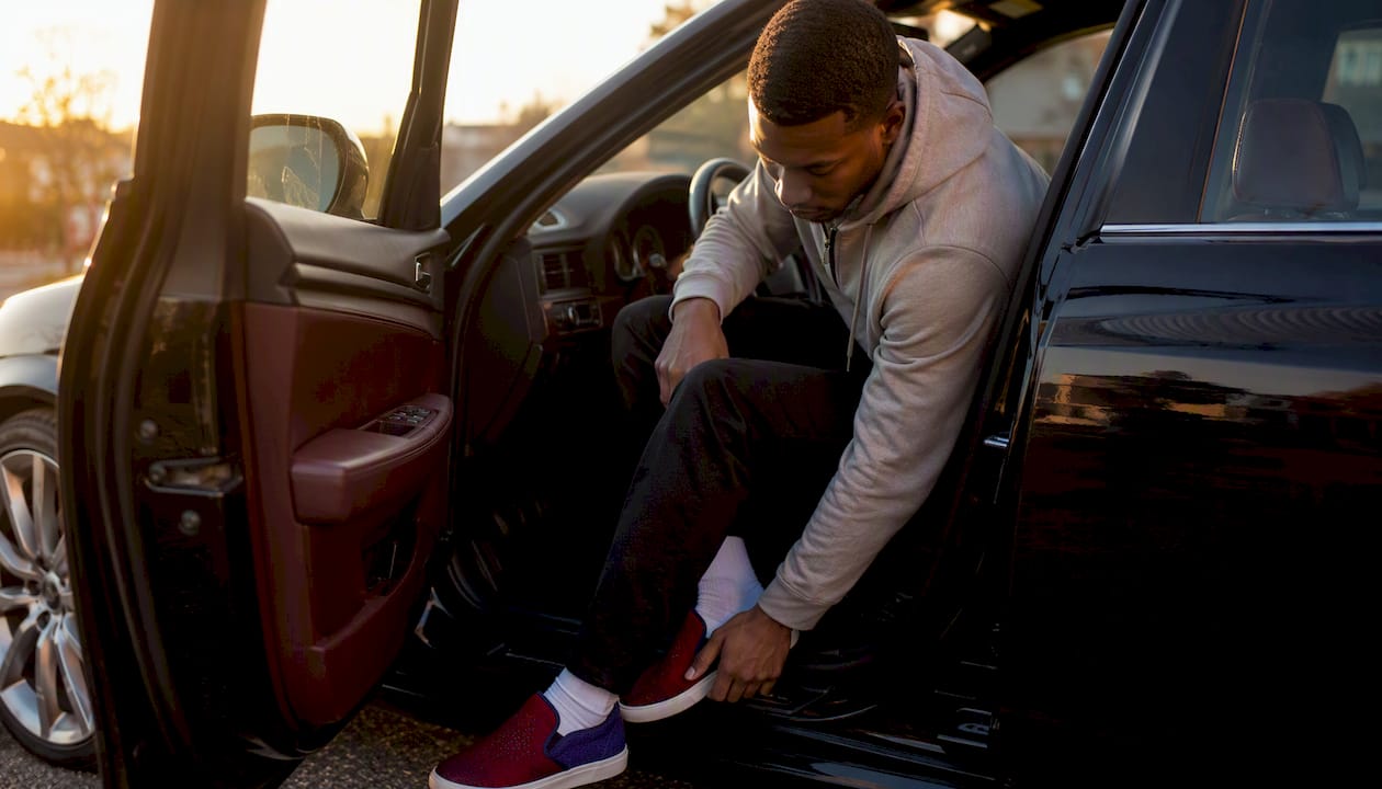 Close-up of slip-on sneakers with joggers and hoodie