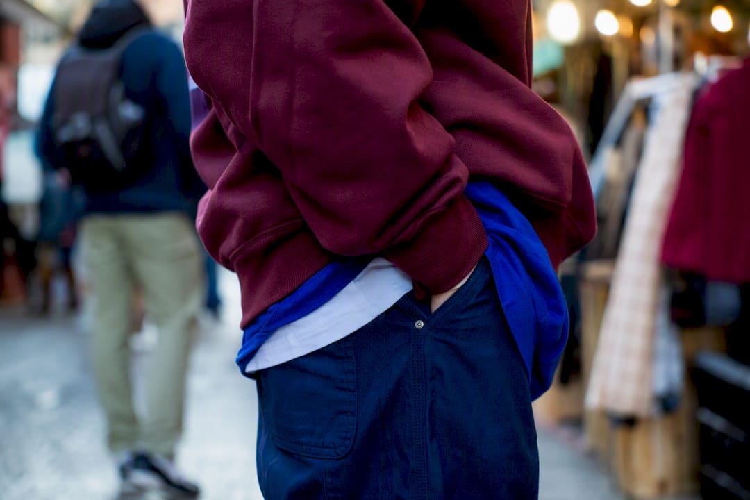 Layered urban streetwear outfit close-up