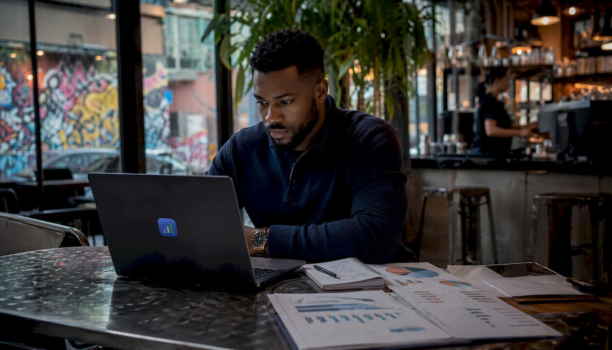 Trader reviewing master trading account spreadsheet