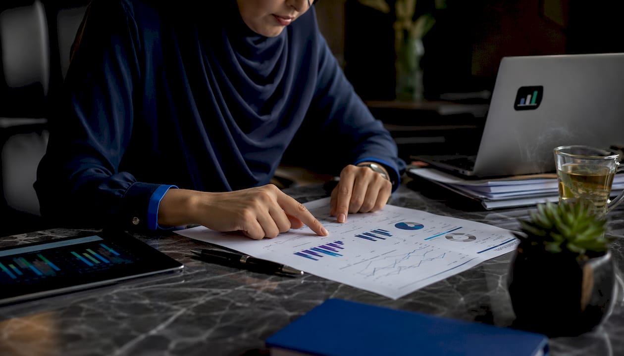 Accountant reviewing financial dashboard report