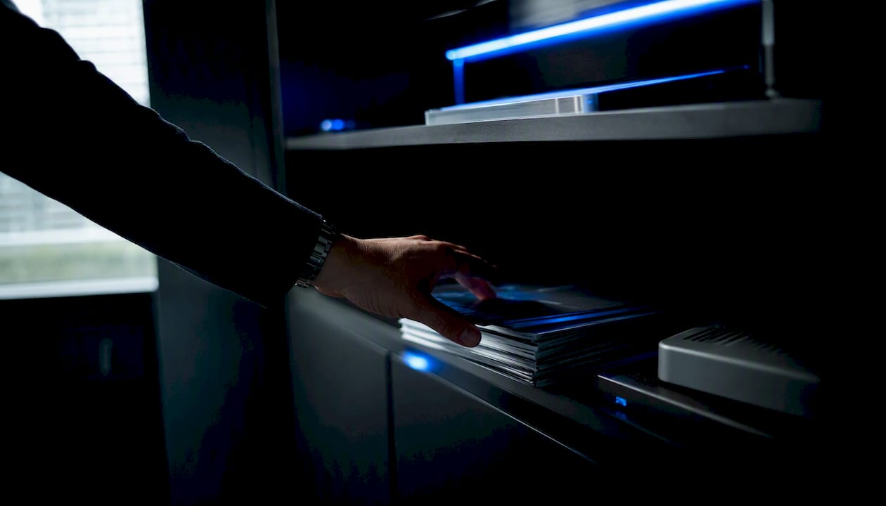 Hand reaching toward trading cost reports