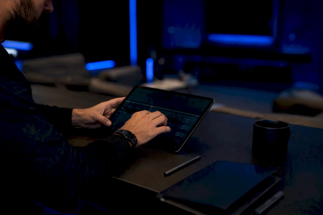 Trader hands adjusting multi-account control knobs