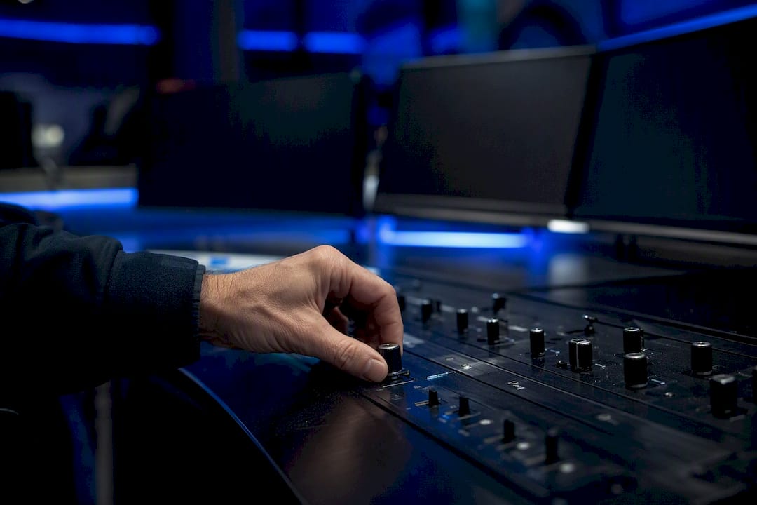 Hand adjusting risk control dial on dark panel