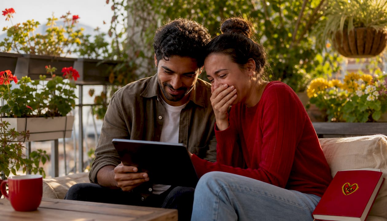 Couple watching a video tribute gift