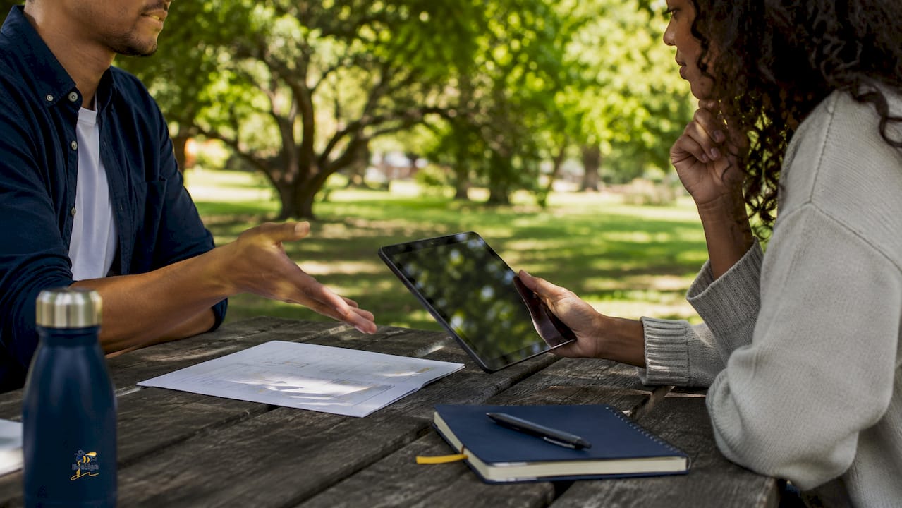 Hands showing digital workflow and documents