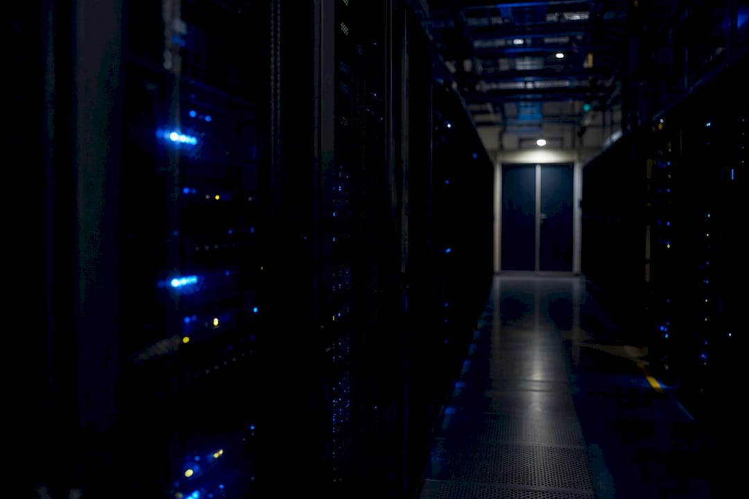 Blurred secure server racks in dimly lit room