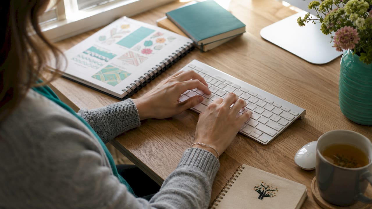 Hands typing managing duplicate product listings