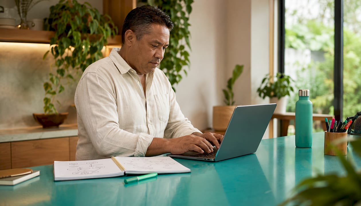 Man managing Google Business Profile on laptop