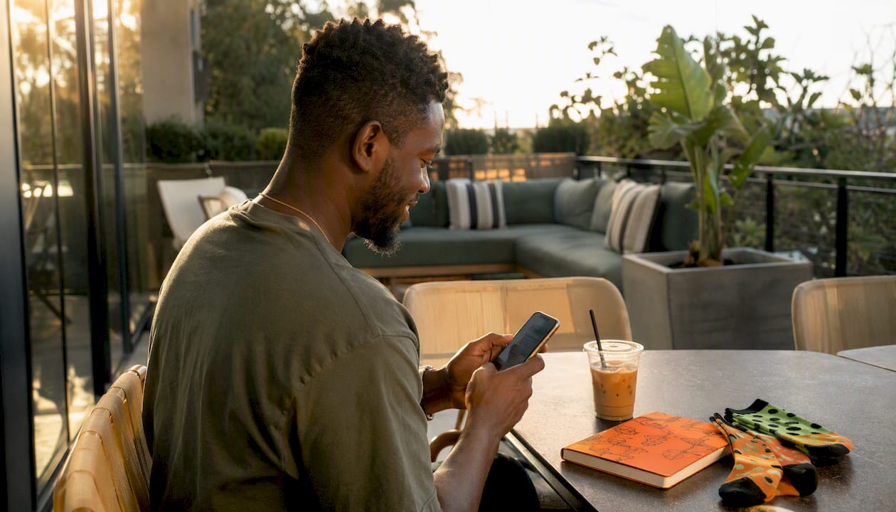 Hands scrolling personality sock quiz on phone