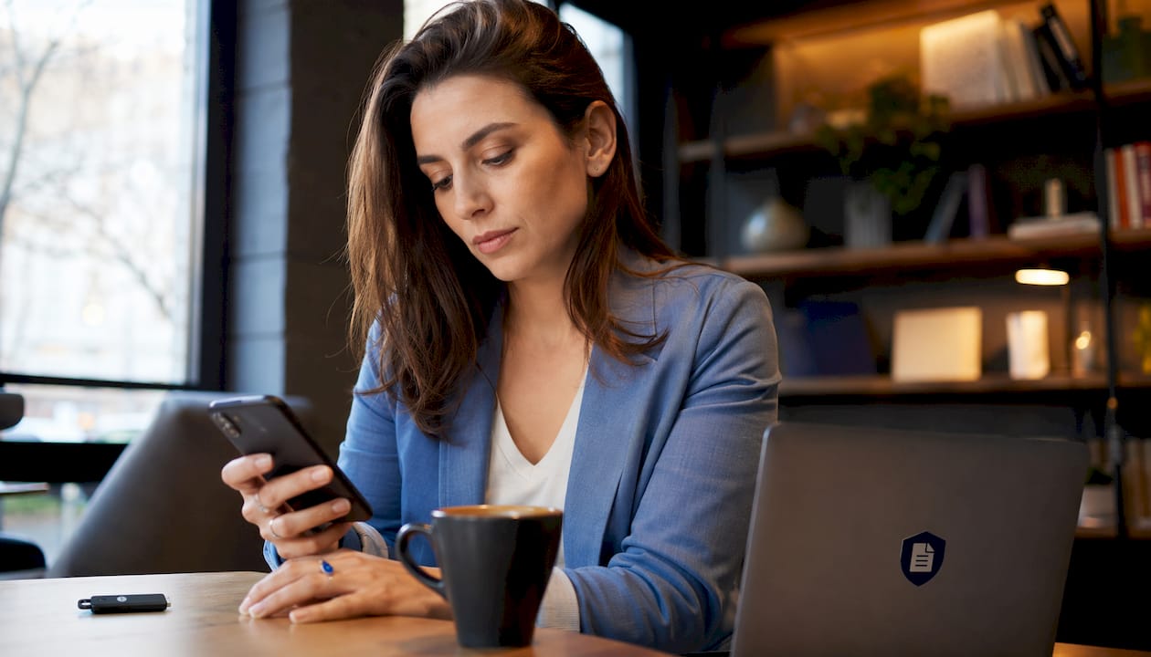 An employee secures her computer access at work using enhanced authentication.