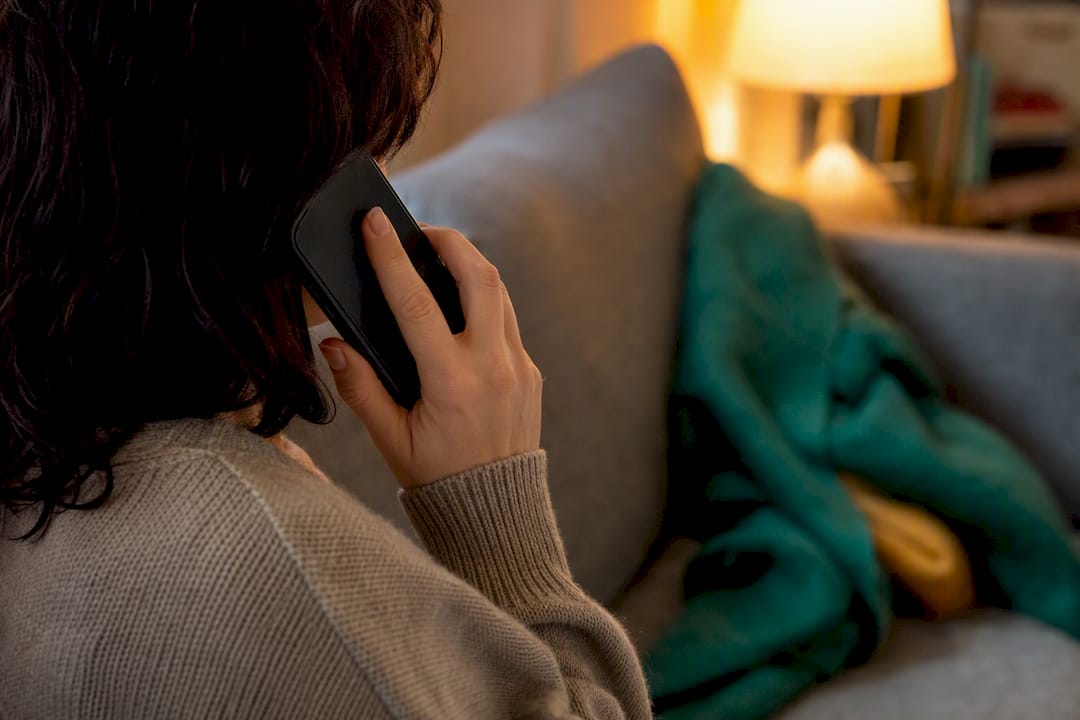 Person confirming subscription cancellation on phone