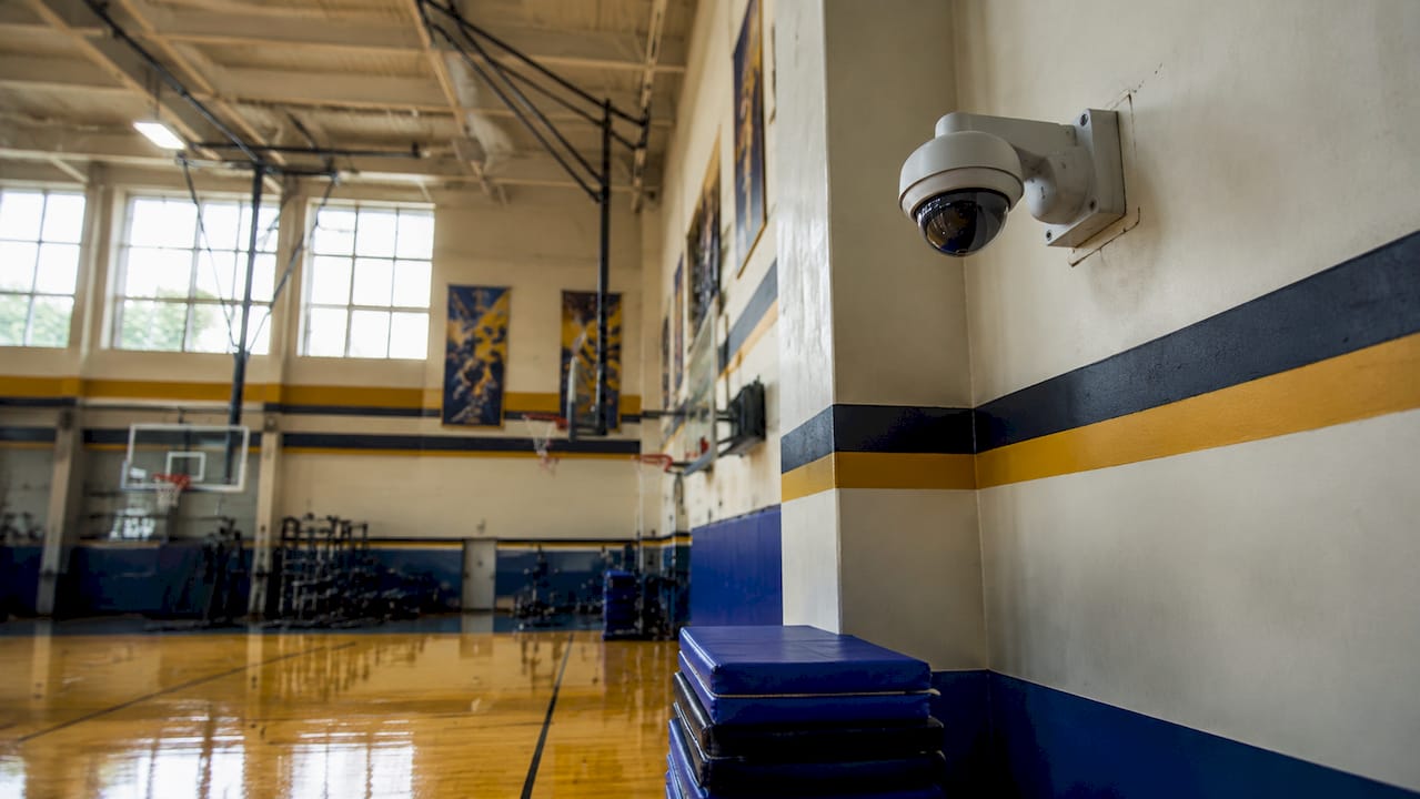 Wall-mounted gymnasium security camera