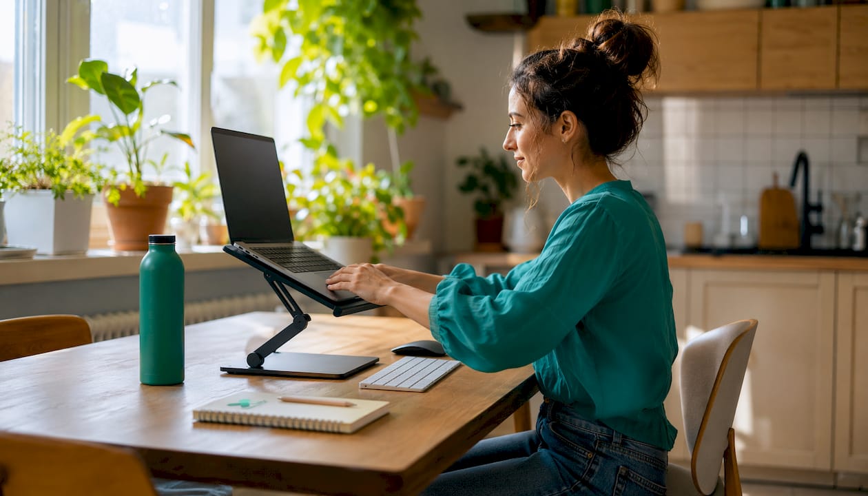 Ergonomic home office desk setup with correct posture