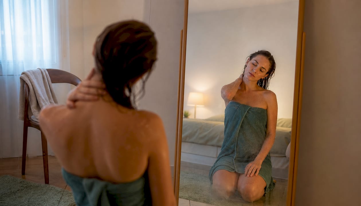 Person doing neck rotations post-shower