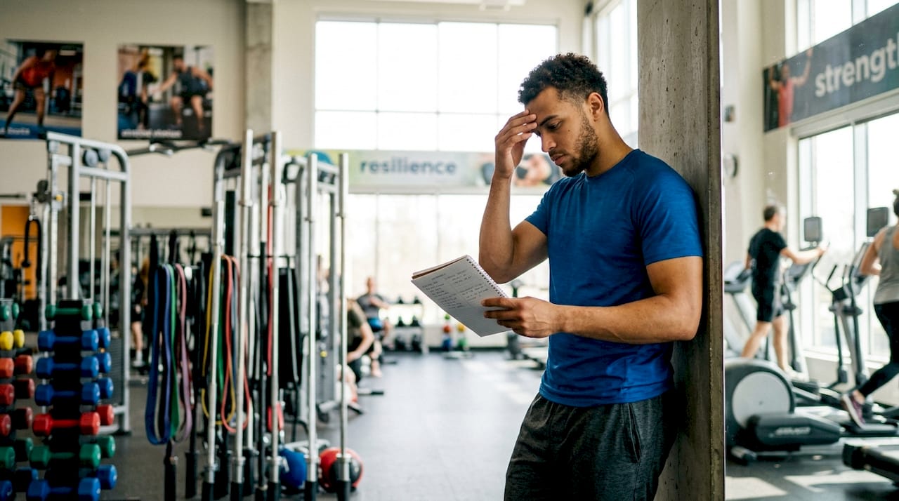 Athlete reviewing chronic pain and training log
