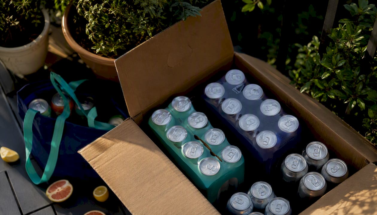 Assorted sparkling beverage packs on kitchen counter