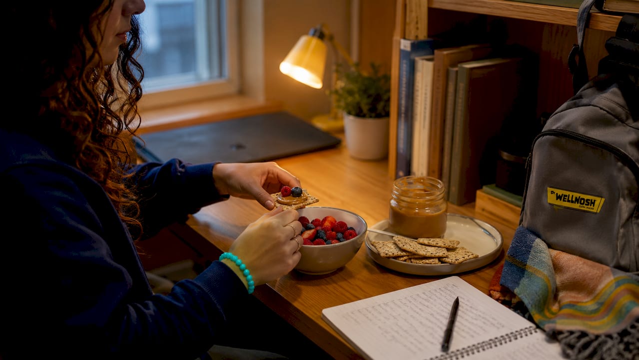 Hands preparing balanced dorm snack