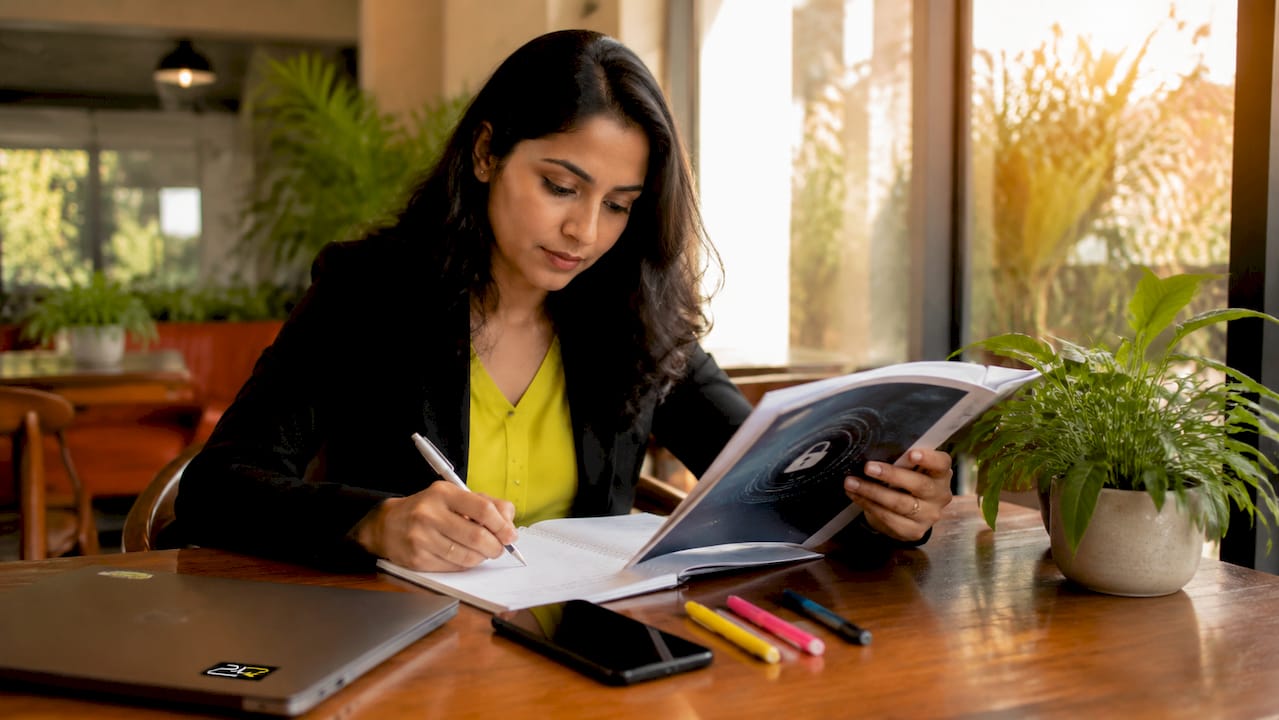 Woman engaged in cybersecurity training at desk
