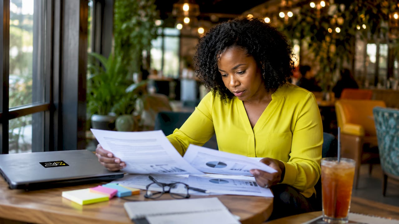 Accountant reviewing security policies at desk