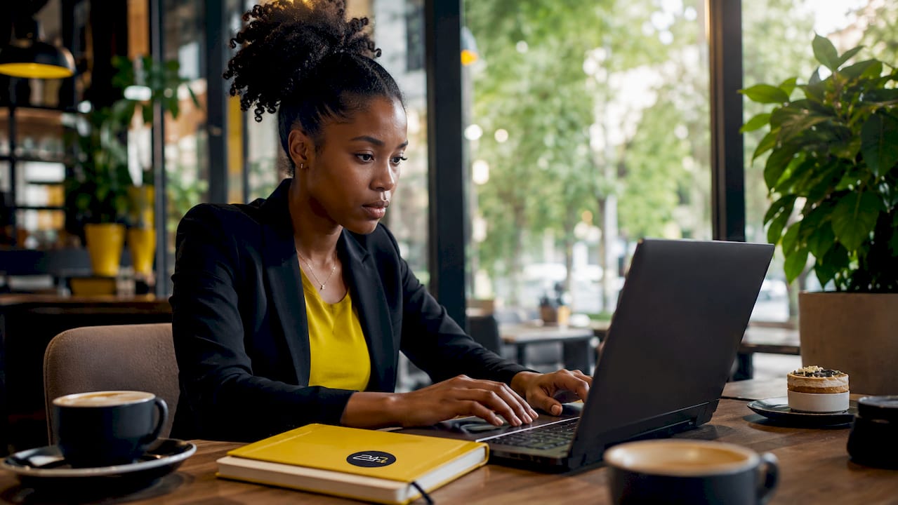 Cybersecurity analyst typing on laptop keyboard