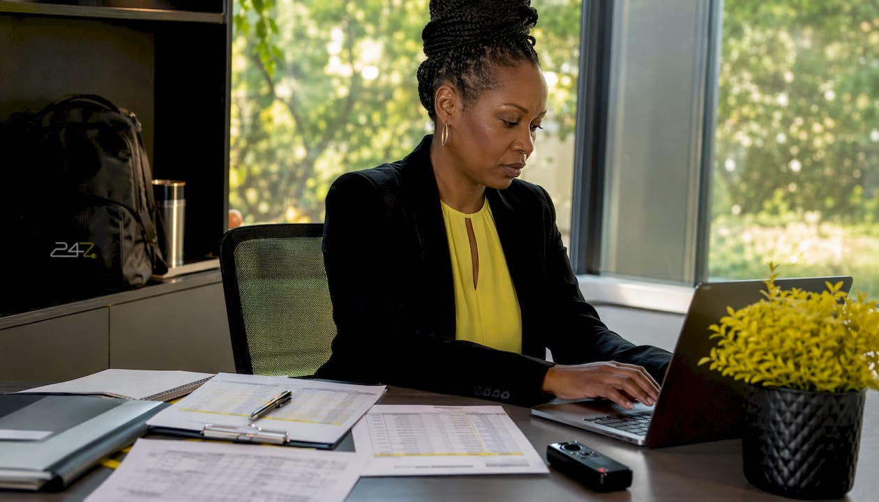 Accountant managing access controls at desk