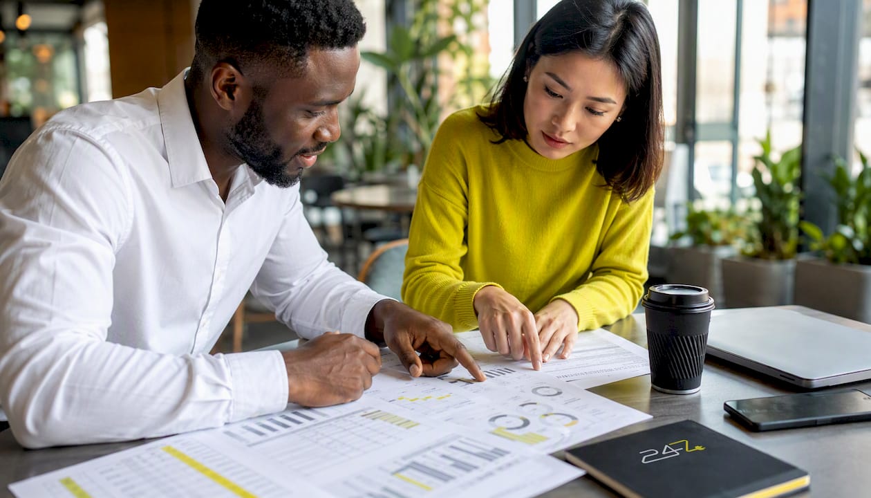 Hands reviewing IT providers comparison documents