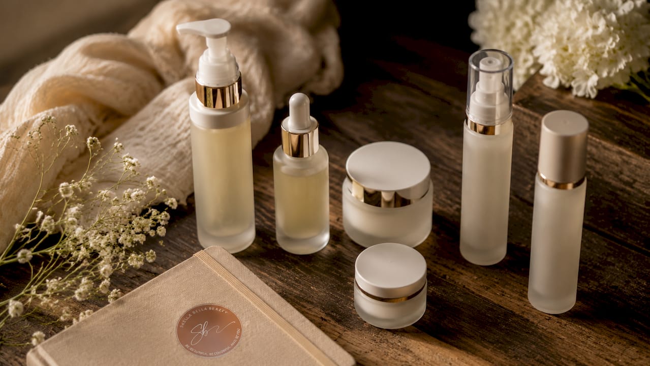 Flat lay of luxury skincare products and towel