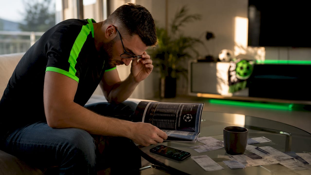 Fan reviewing UEFA rankings at home