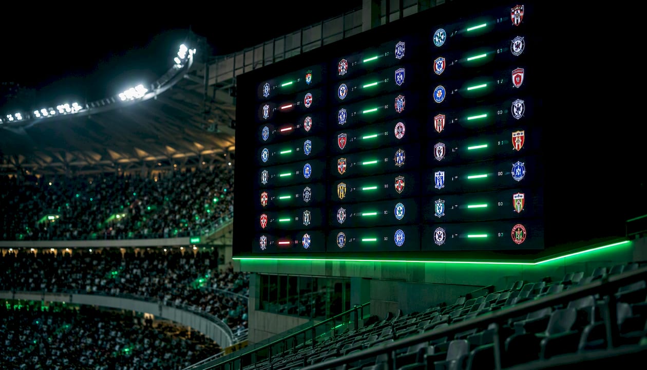 Football stadium scoreboard showing form results