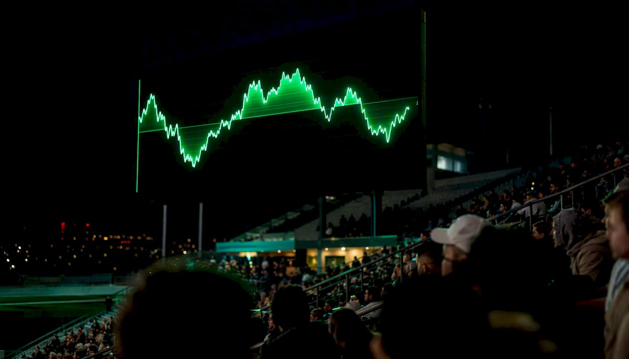 Stadium scoreboard displaying football xP momentum graph