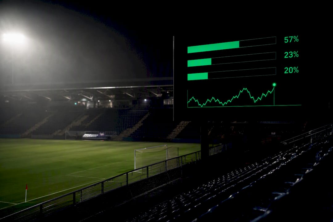 Football stadium scoreboard with win-probability data