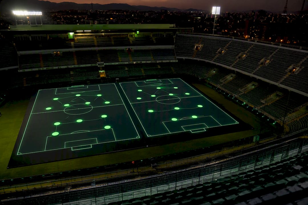 Digital football formation displayed inside stadium