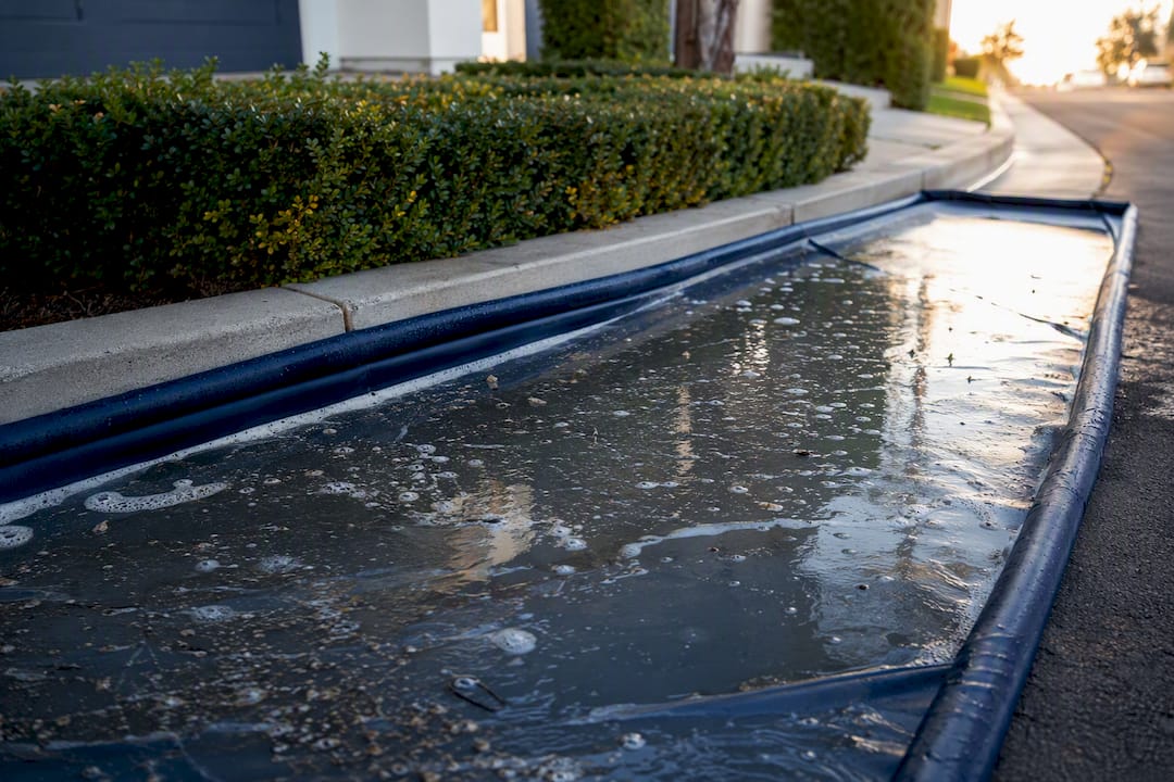 Containment pad capturing runoff water