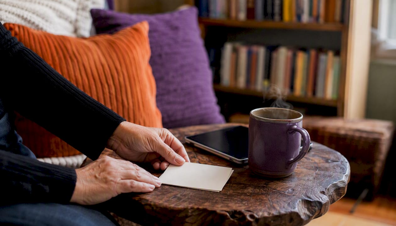 Hands arranging conversation starter checklist