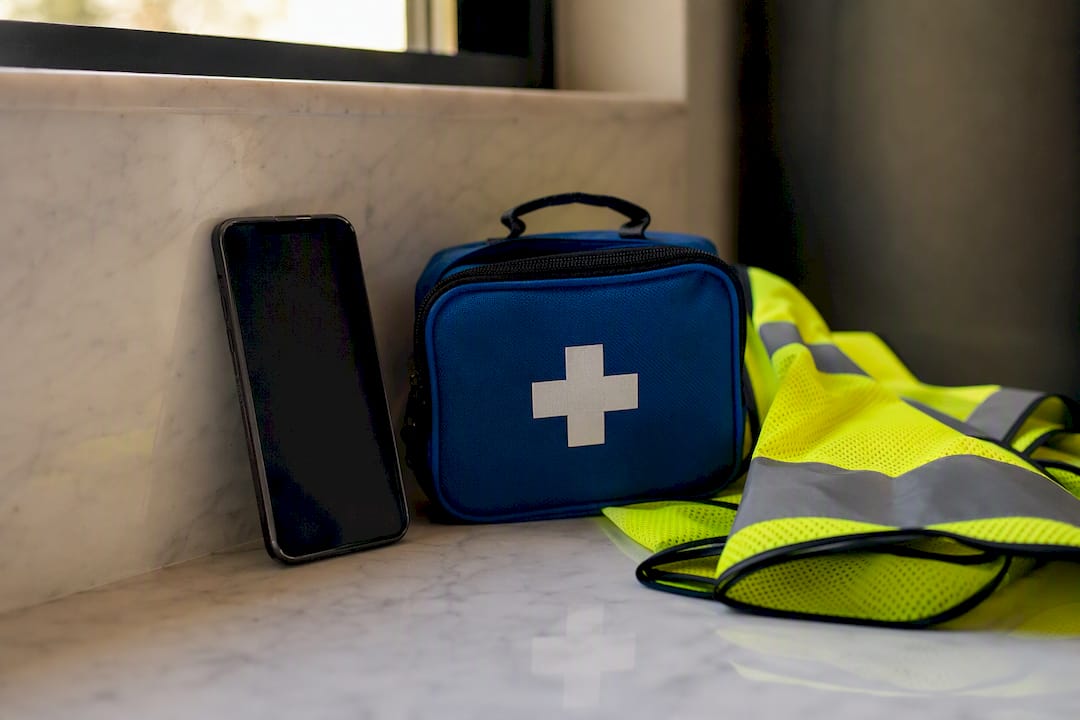 Smartphone with app off and emergency items nearby