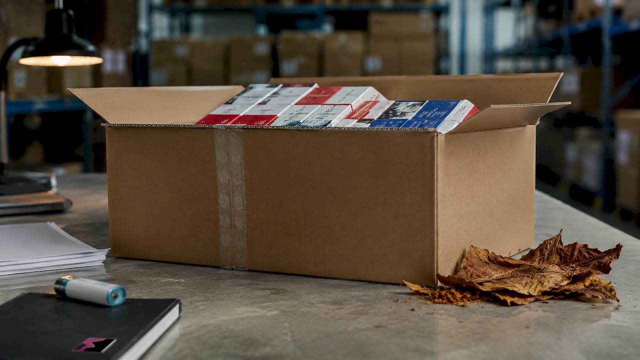 Close-up of plain outer box with cigarette cartons inside