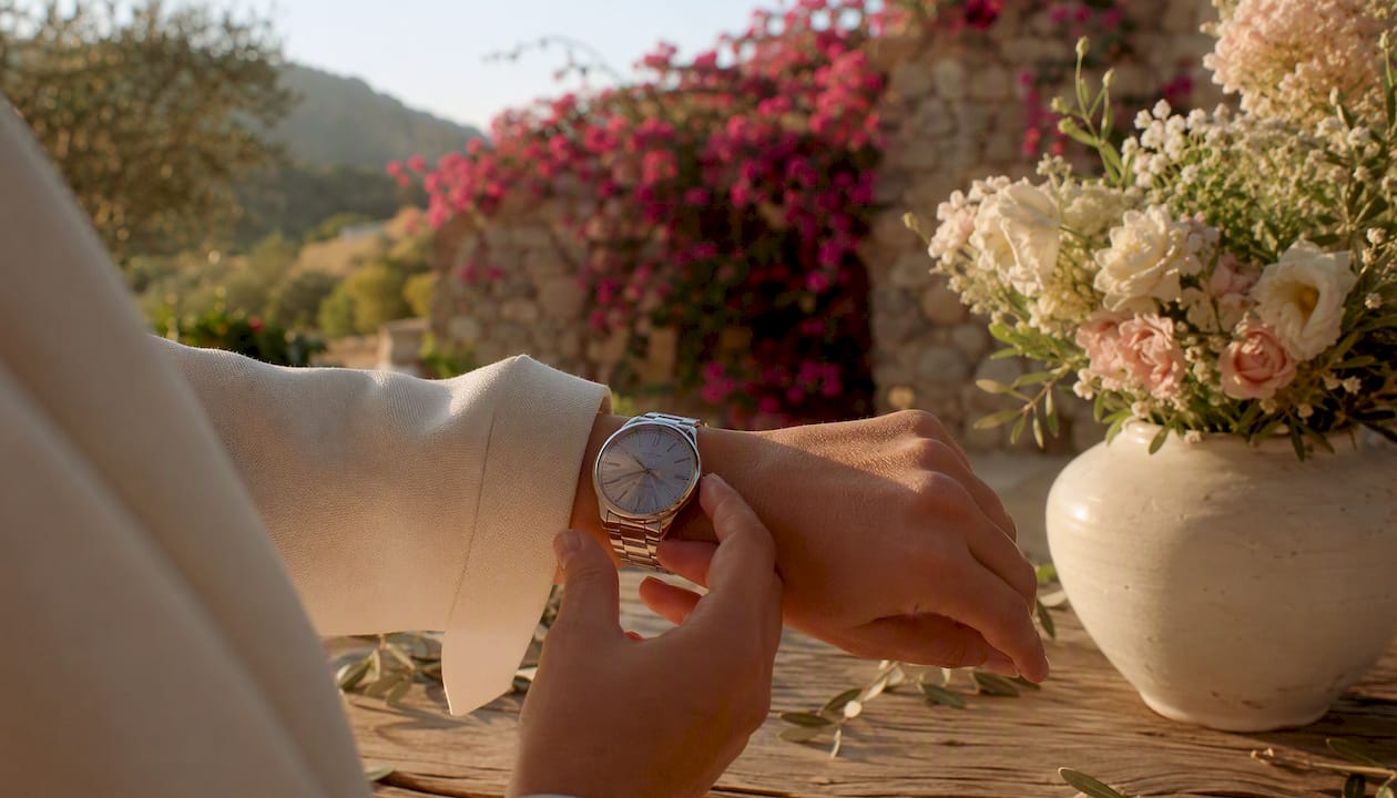 Close-up of elegant watch on wrist in Mediterranean garden