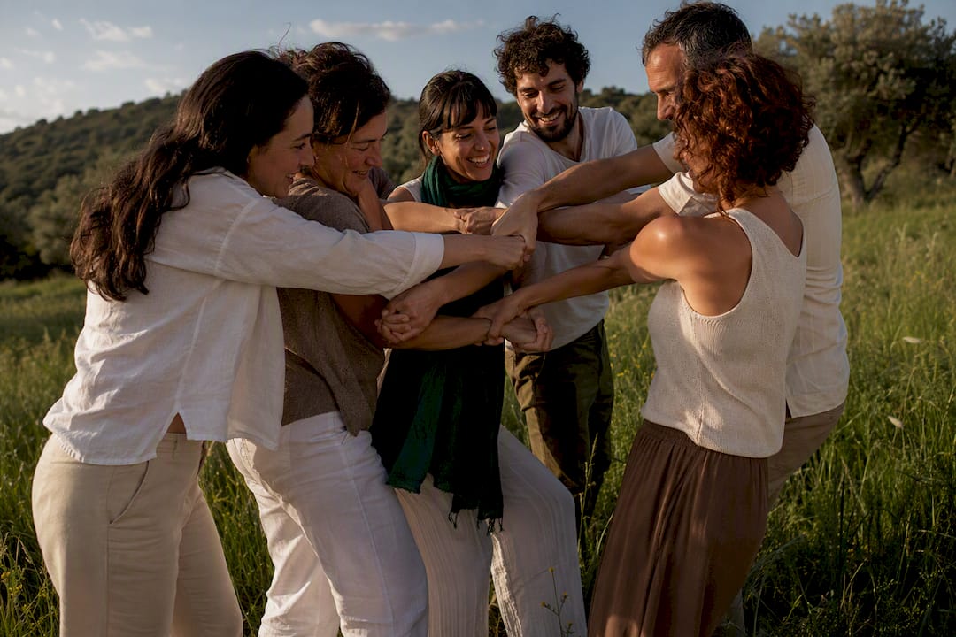Group untangling a Human Knot outdoors