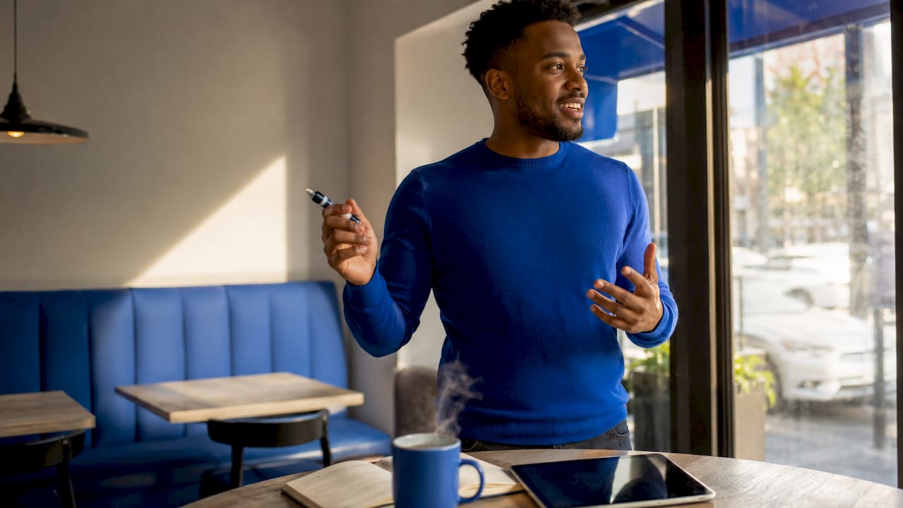 Man discussing analytics tools near whiteboard
