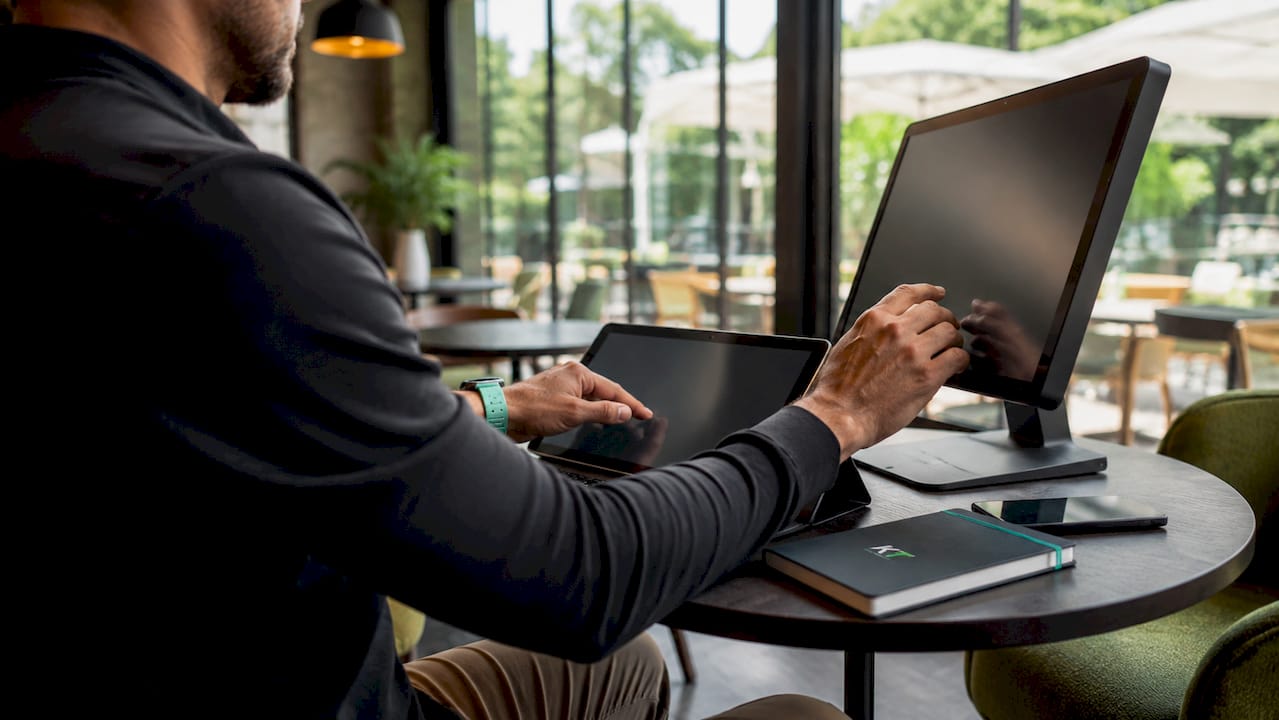 Trader’s hands using specialized trading setup