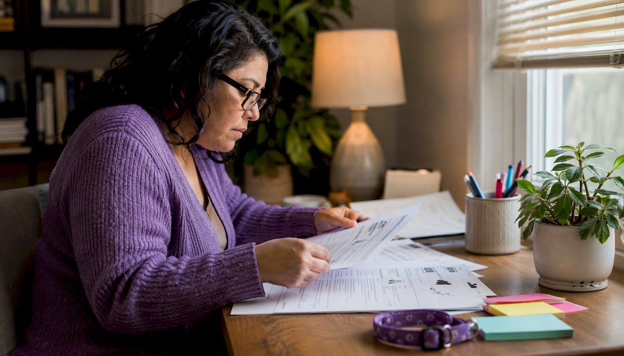 Woman reviewing pet accountability documents