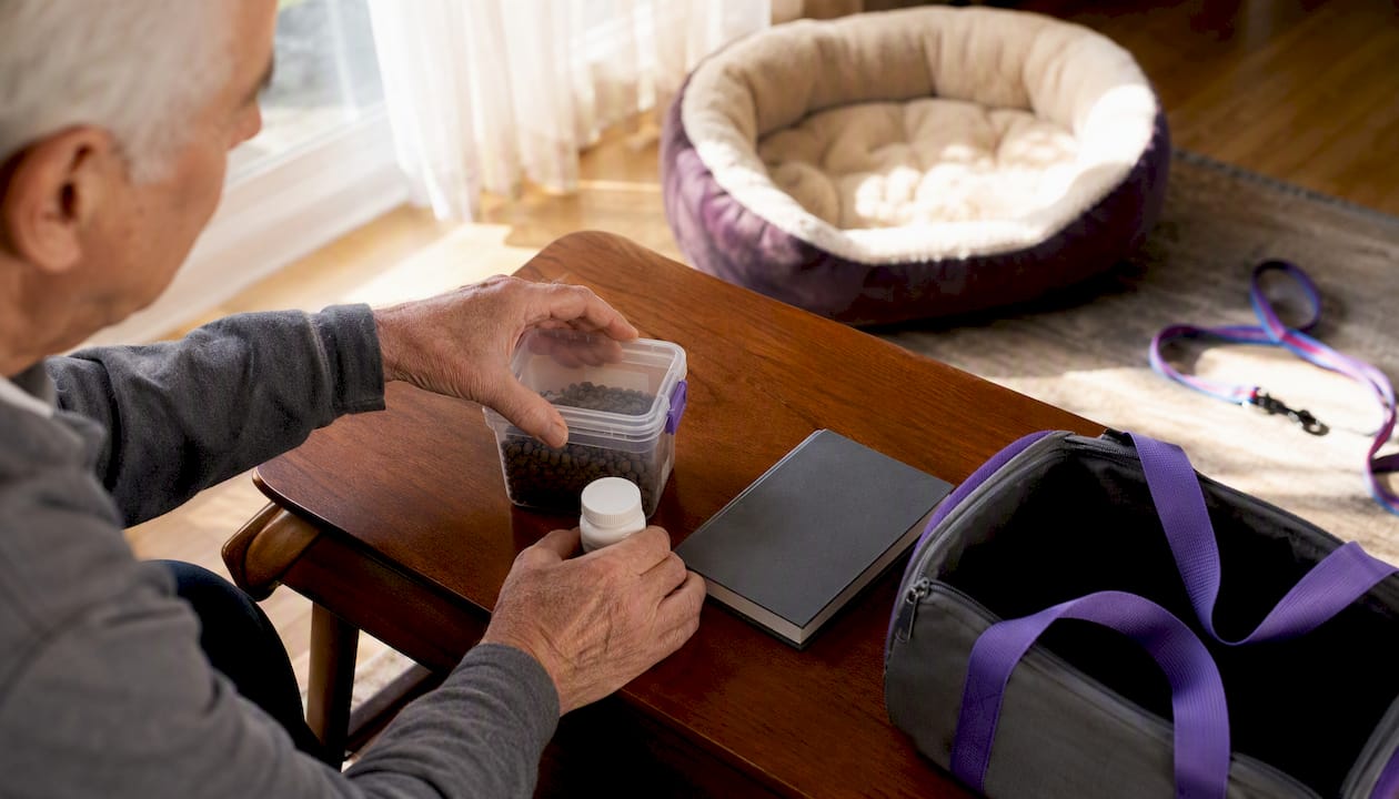 Senior assembling pet emergency care kit