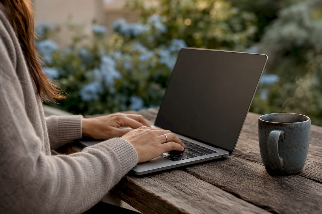 Hands typing business description for SEO