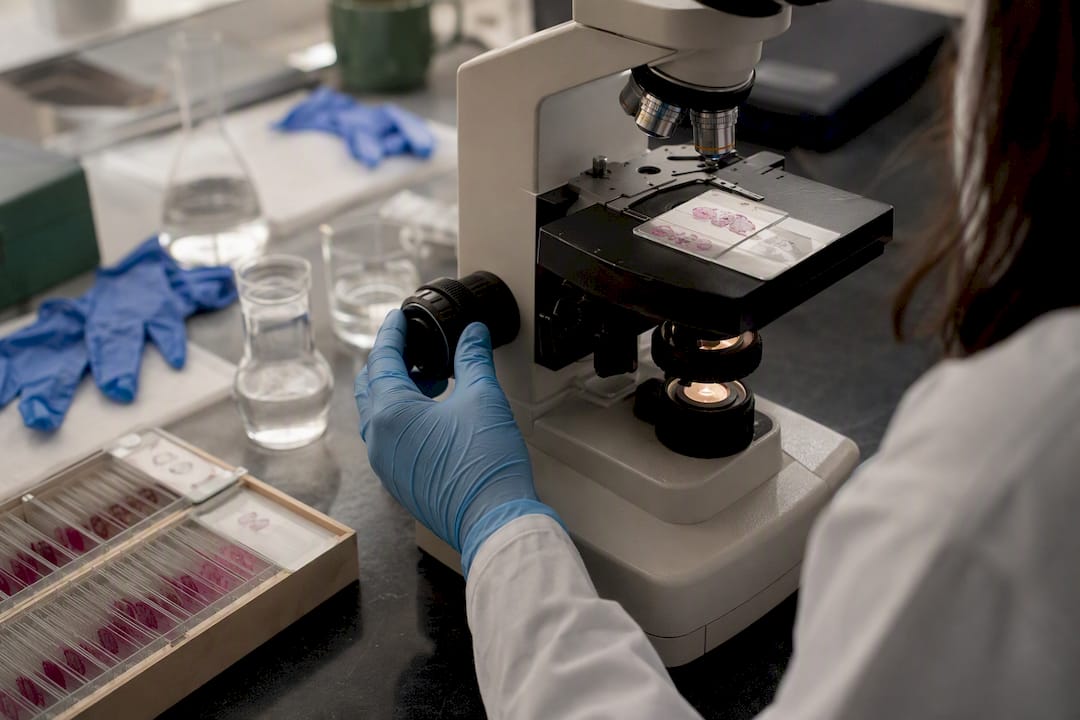 Microscope and rodent thyroid tissue slide in lab