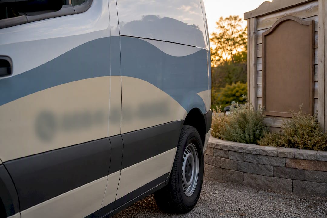 Vehicle wrap and yard sign with anonymous phone details